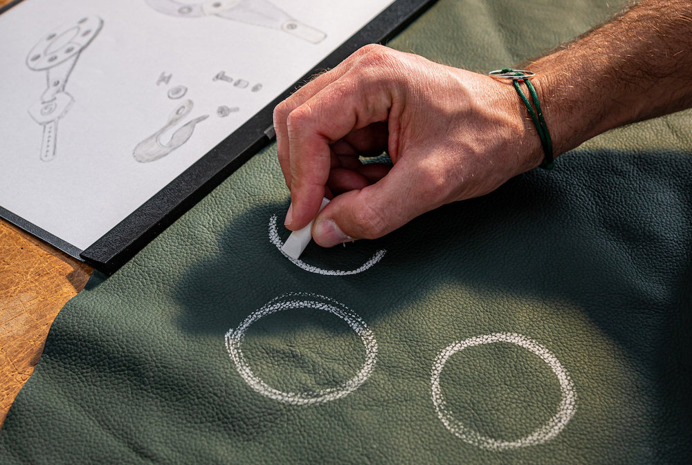 Drawing shapes on green upholstery leather